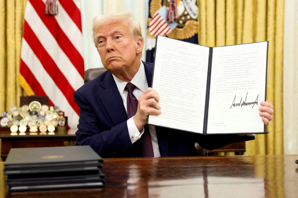 FILE PHOTO: U.S. President Trump signs an executive order in the Oval Office, at the White House